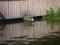 Wasserspiegelung am Bootshaus